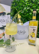 Bottle of Wild Life in an ice bucket next to a bottle of Ramtang Limoncello and a cocktail using the two ingredients.