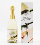 Wild Life Botanicals Nude bottle on table. Ultra-low alcohol, low calorie and low carb sparkling wine. Healthy wine alternative. Bespoke Wild Life gift box incorporating original piece of artwork by Cornish artist.